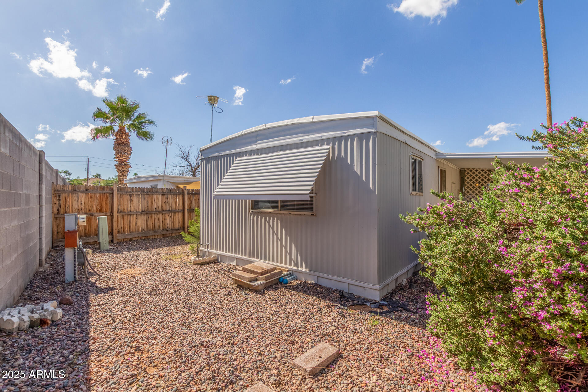 16225 North Cave Creek Road, Unit 140 Phoenix, AZ 85032 - Photo 23 of 32 a front view of a house with a yard