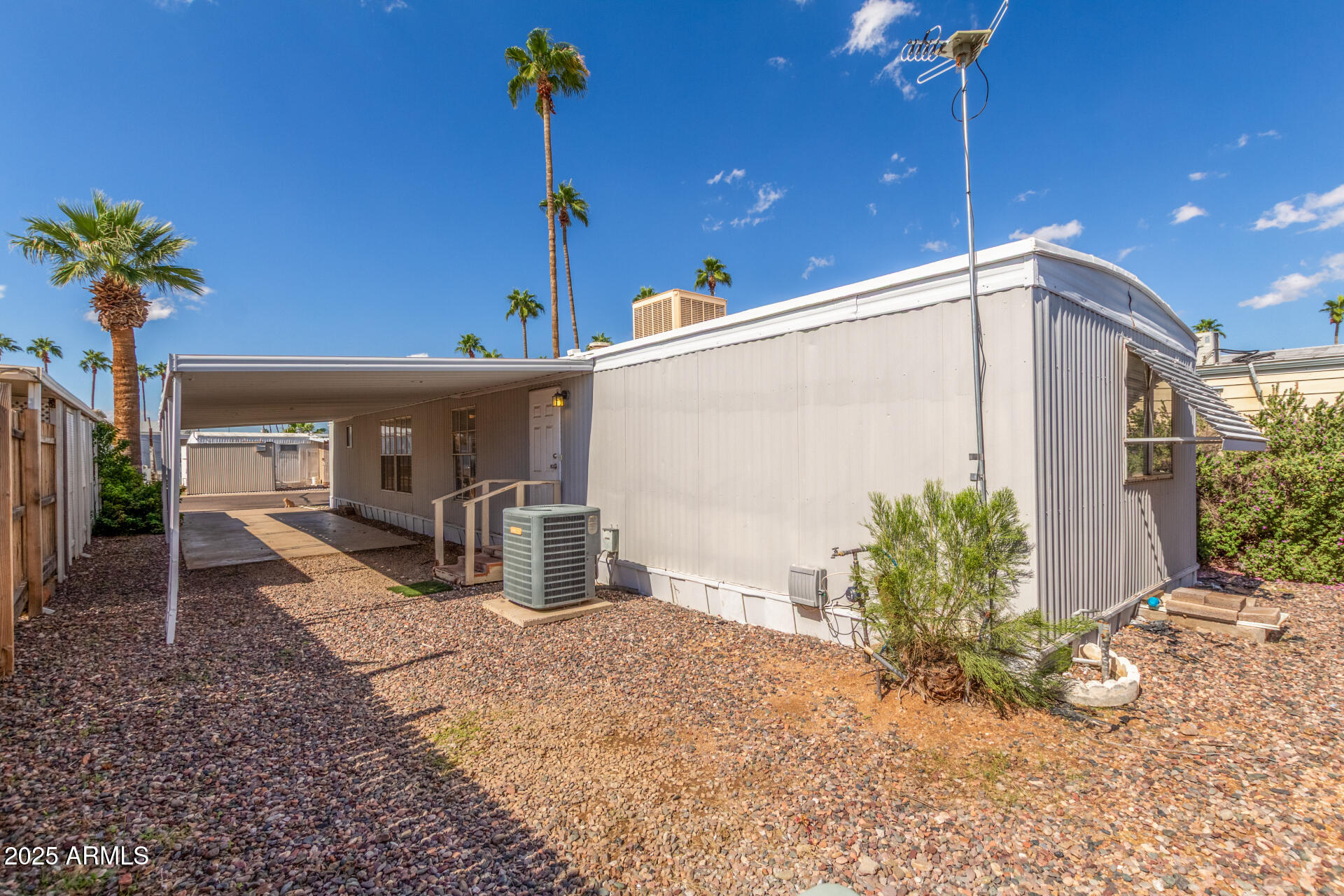 16225 North Cave Creek Road, Unit 140 Phoenix, AZ 85032 - Photo 24 of 32 a front view of a house with garden