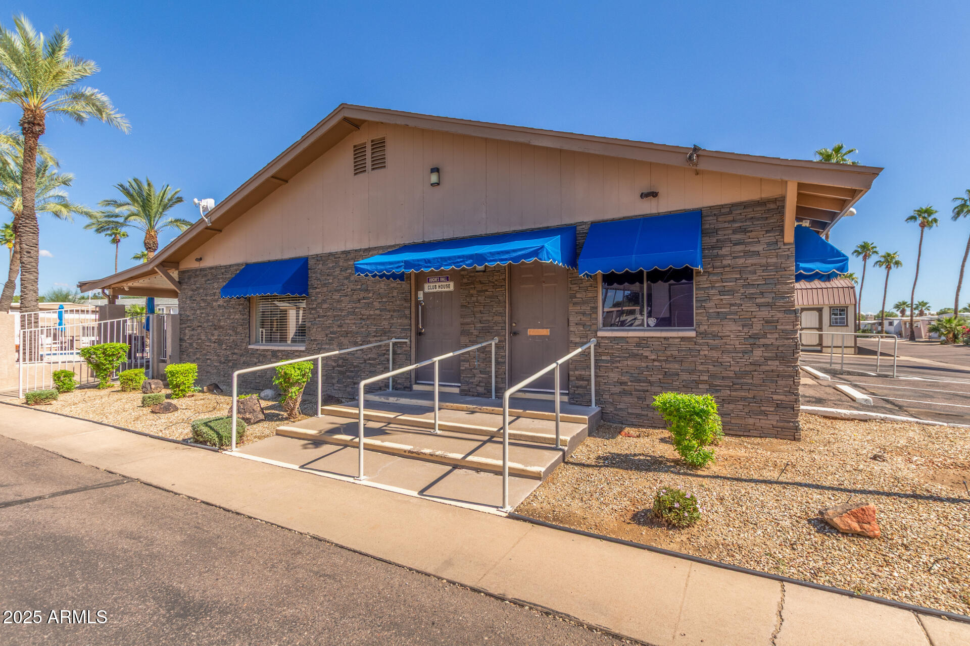 16225 North Cave Creek Road, Unit 140 Phoenix, AZ 85032 - Photo 26 of 32 a front view of a house with garden