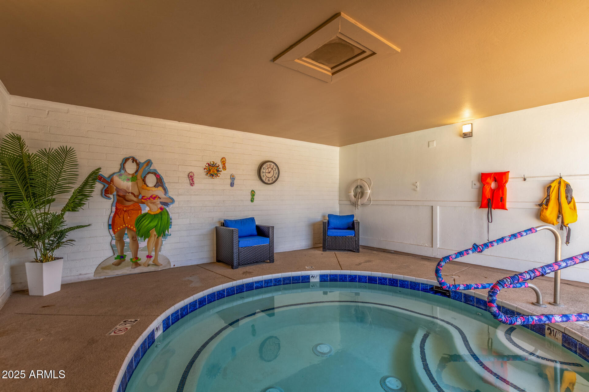 16225 North Cave Creek Road, Unit 140 Phoenix, AZ 85032 - Photo 32 of 32 a bedroom with a bed and ceiling fan