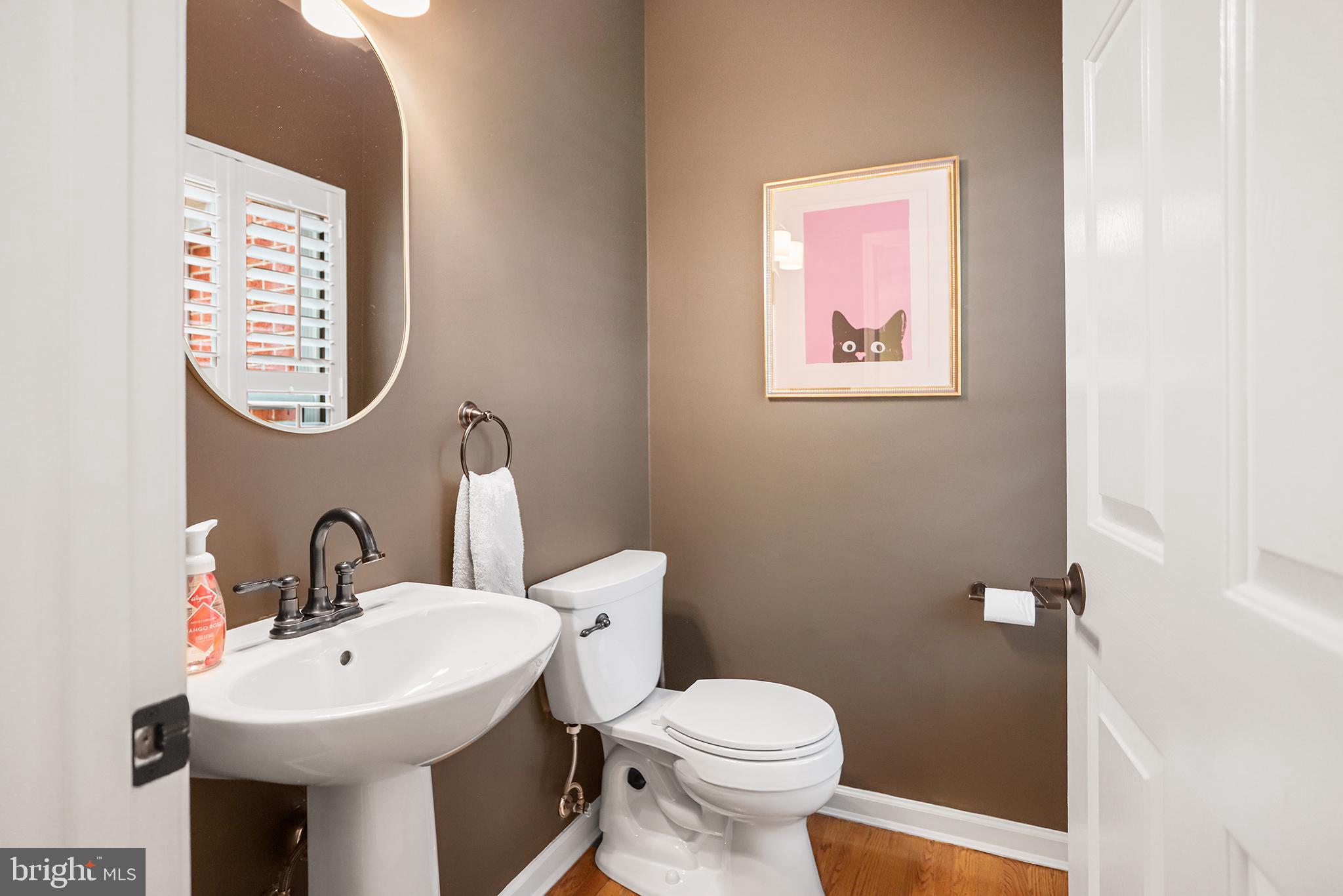 59 Huntingdon Farm Drive Glen Mills, PA 19342 - Photo 13 of 36 Chic half-bath with playful art accents.