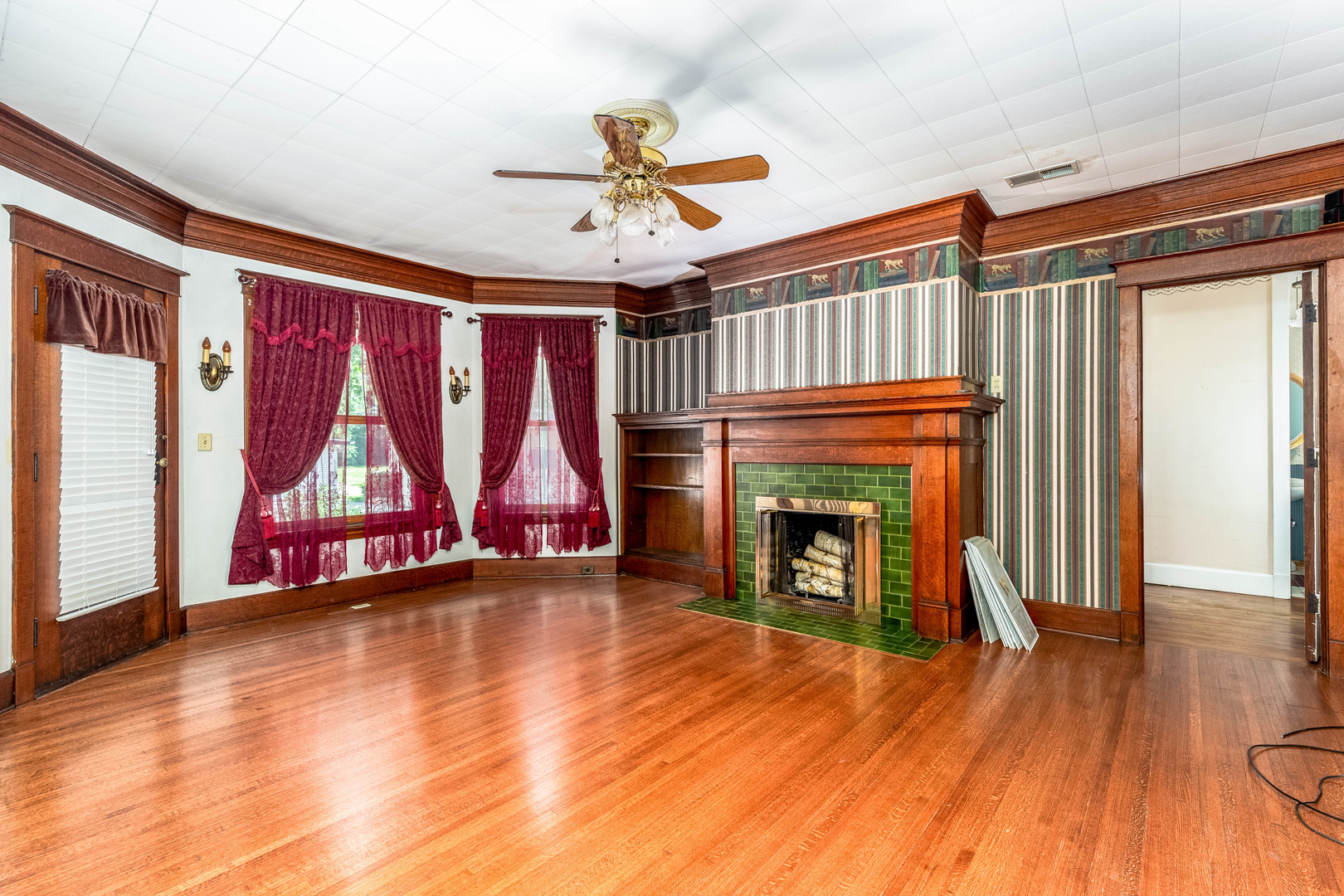 809 Ottawa Avenue Ottawa, IL 61350 - Photo 8 of 39 a view of an empty room with wooden floor fireplace and a window