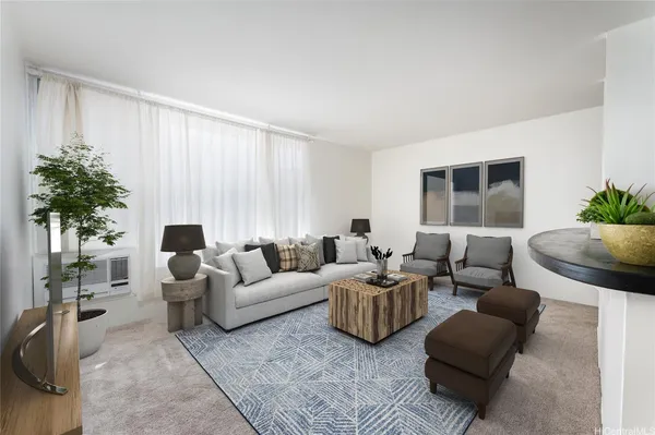 a living room with furniture and a large window