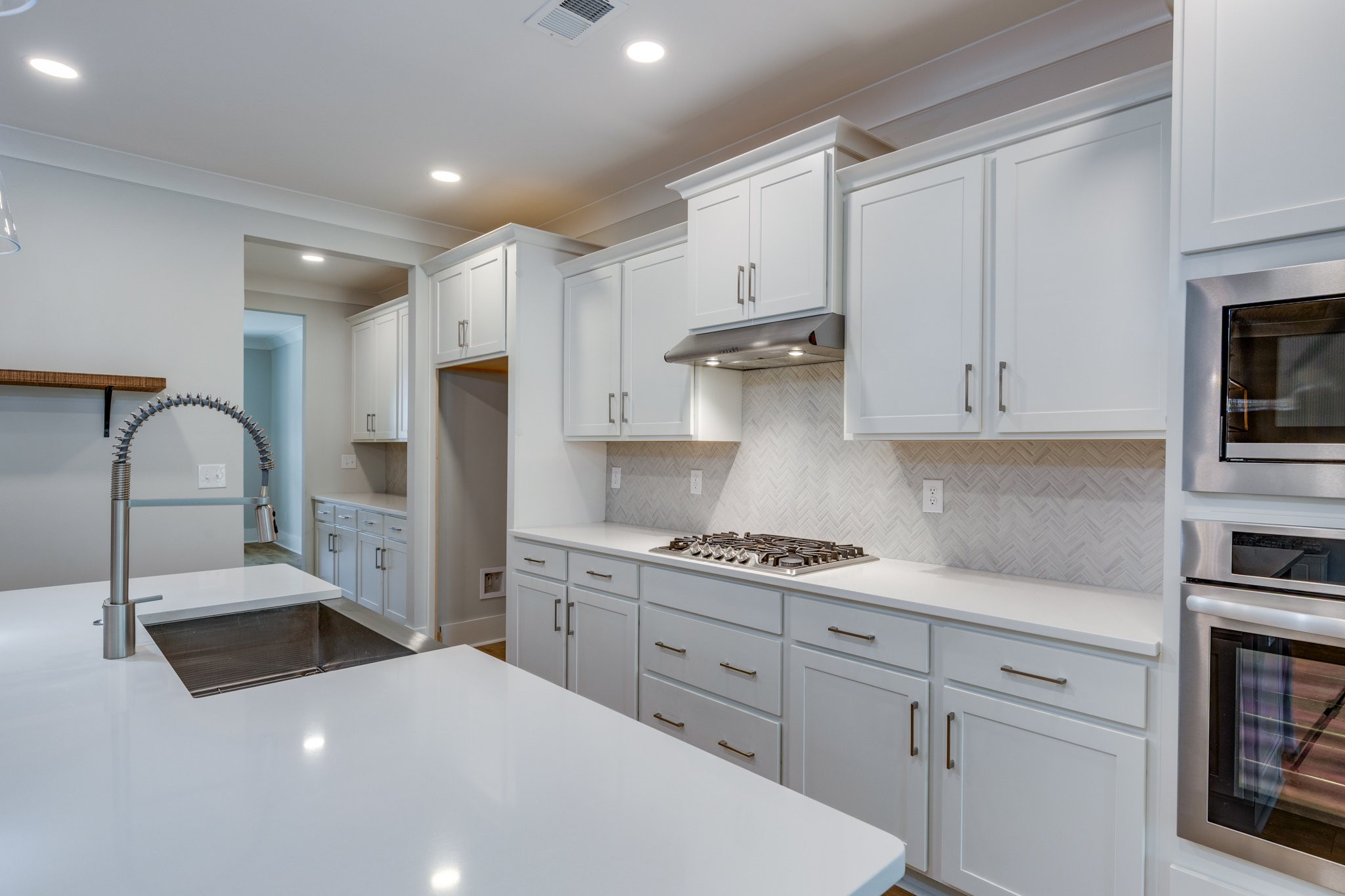 2110 Lequire Lane Spring Hill, TN 37174 - Photo 13 of 76 a kitchen with stainless steel appliances granite countertop a stove a sink and a refrigerator