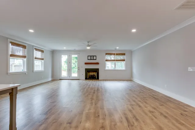 a spacious bathroom with a double vanity sink and mirror