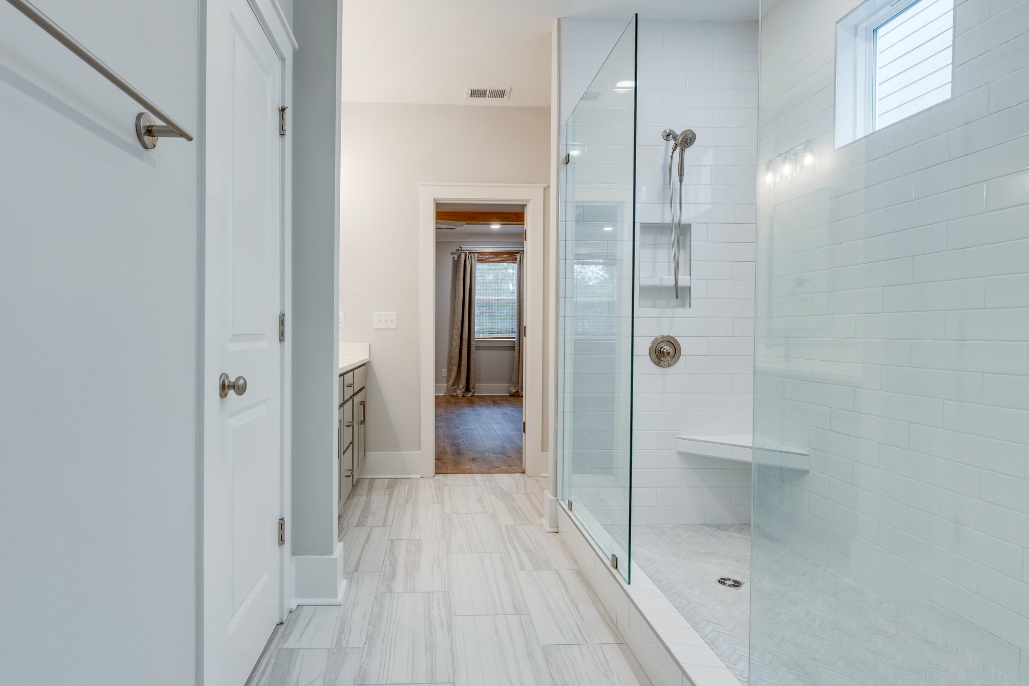 2110 Lequire Lane Spring Hill, TN 37174 - Photo 31 of 76 a bathroom with a shower and a glass door