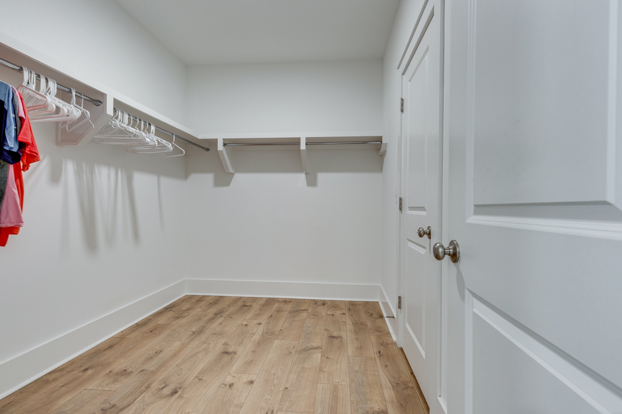 2110 Lequire Lane Spring Hill, TN 37174 - Photo 34 of 76 a view of walk in closet with empty racks