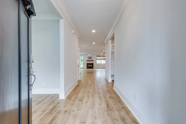a living room with furniture fireplace and window