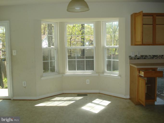 570 Balsom Road Lusby, MD 20657 - Photo 2 of 16 a view of an empty room and window
