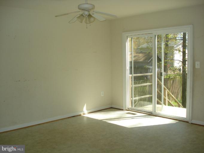 570 Balsom Road Lusby, MD 20657 - Photo 11 of 16 an empty room with a window