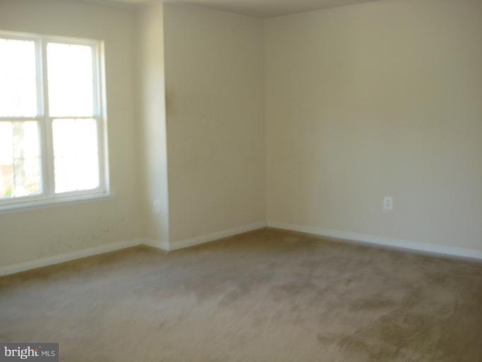 570 Balsom Road Lusby, MD 20657 - Photo 15 of 16 an empty room with a window