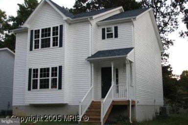 570 Balsom Road Lusby, MD 20657 - Photo 16 of 16 a view of house with deck and outdoor space
