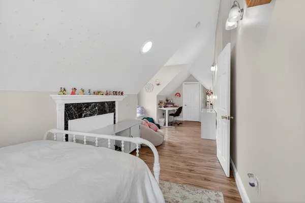 a bedroom with bed and window