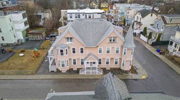an aerial view of residential houses with outdoor space