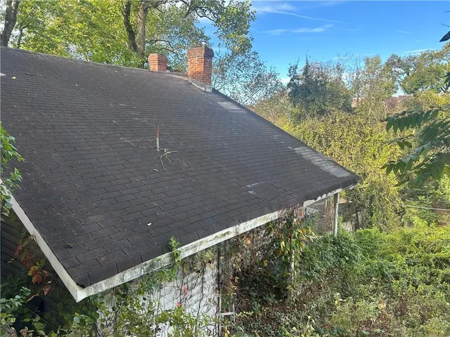 a backyard of a house with lots of green space