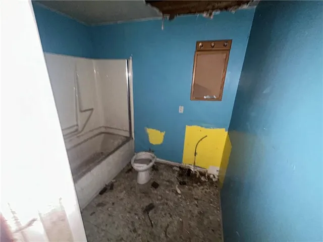 a bathroom with a toilet and a sink