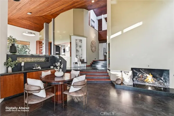 a view of a living room and floor to ceiling window
