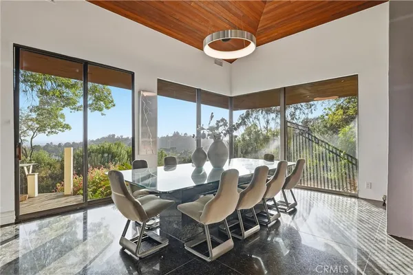 a dinning table and chairs in a patio