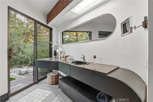 a bathroom with a sink and a mirror