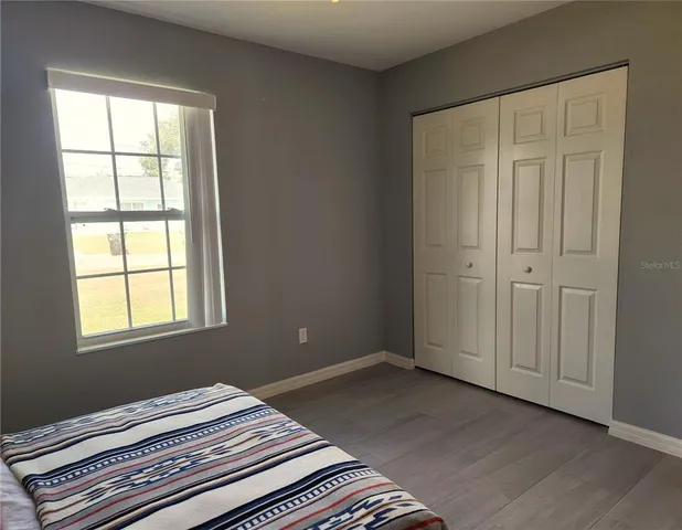 a bathroom with a double vanity sink toilet and a mirror