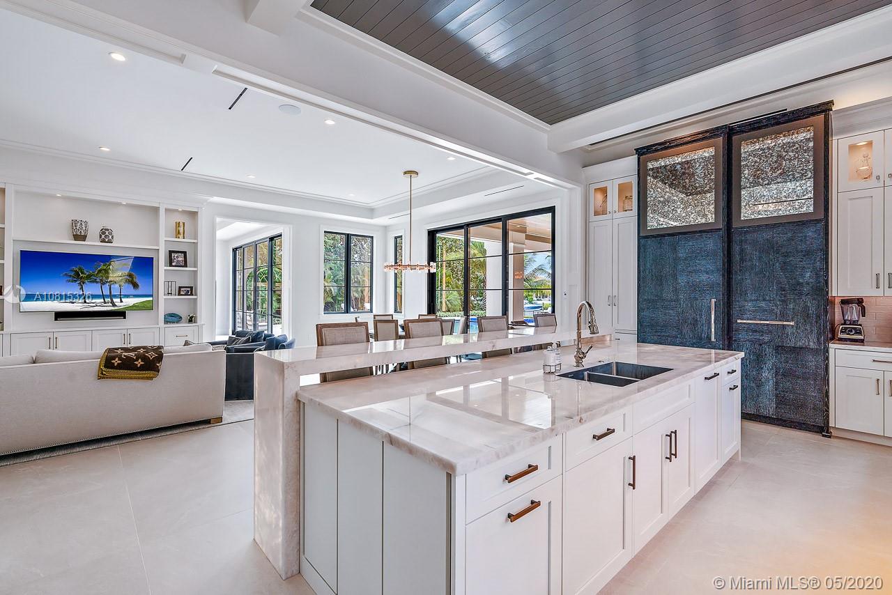 220 Commodore Drive Jupiter, FL 33477 - Photo 17 of 55 a kitchen with stainless steel appliances granite countertop a lot of counter space and a window