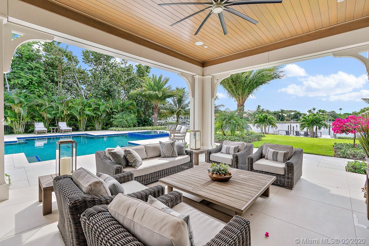220 Commodore Drive Jupiter, FL 33477 - Photo 21 of 55 a outdoor living space with furniture and garden view