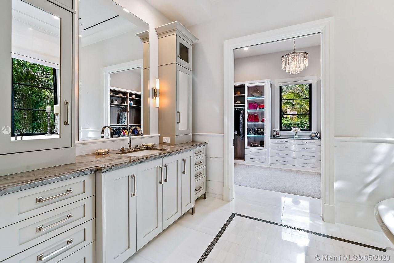 220 Commodore Drive Jupiter, FL 33477 - Photo 28 of 55 a bathroom with a granite countertop sink mirror and window
