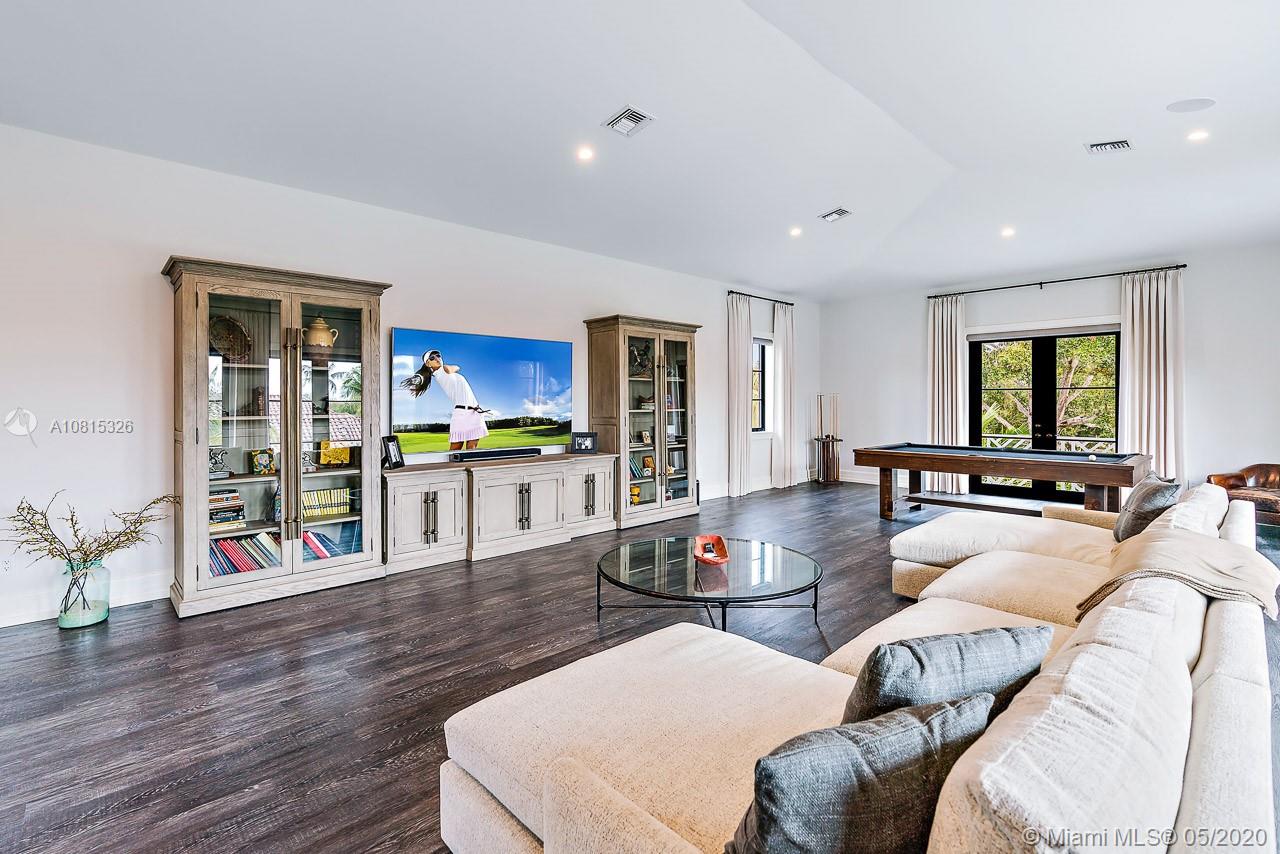 220 Commodore Drive Jupiter, FL 33477 - Photo 31 of 55 a living room with furniture and a wooden floor