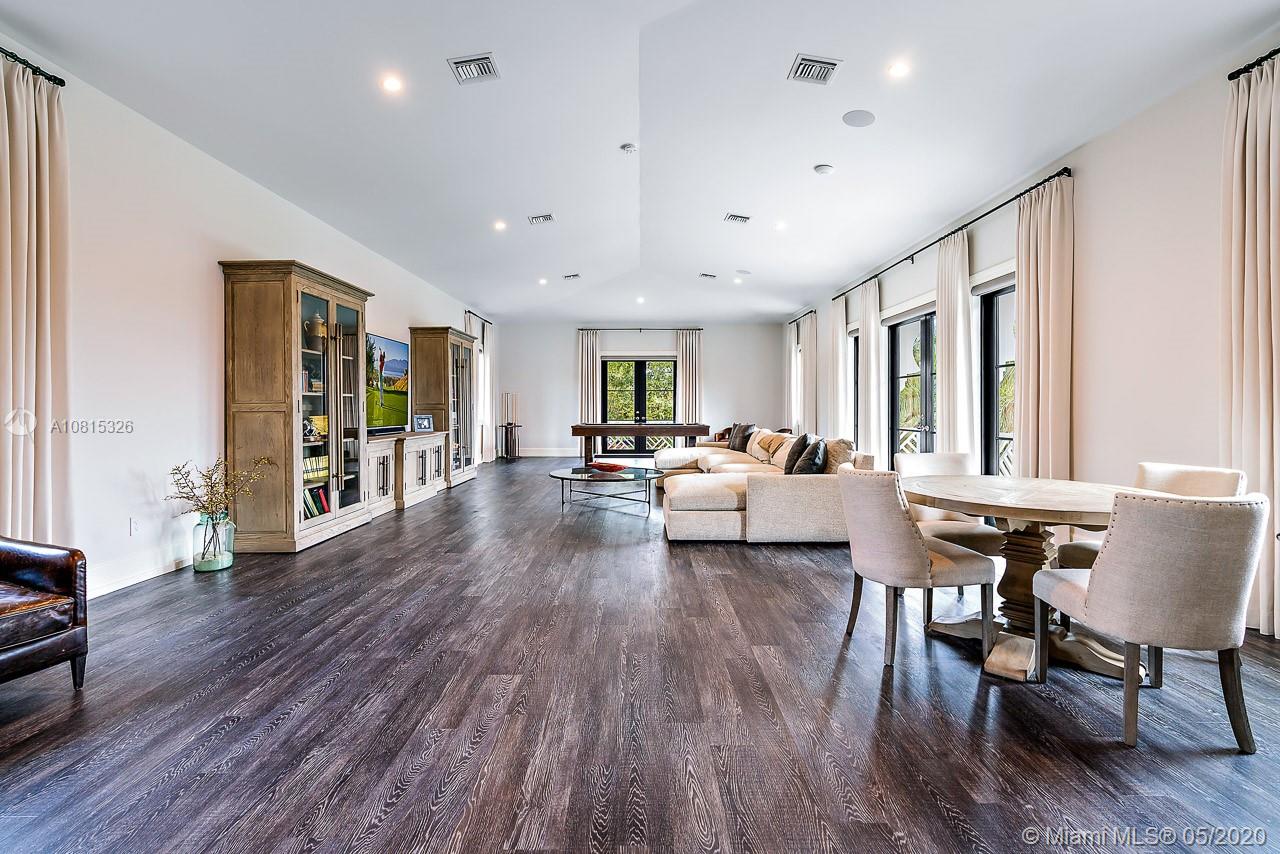 220 Commodore Drive Jupiter, FL 33477 - Photo 32 of 55 a living room with furniture and a wooden floor