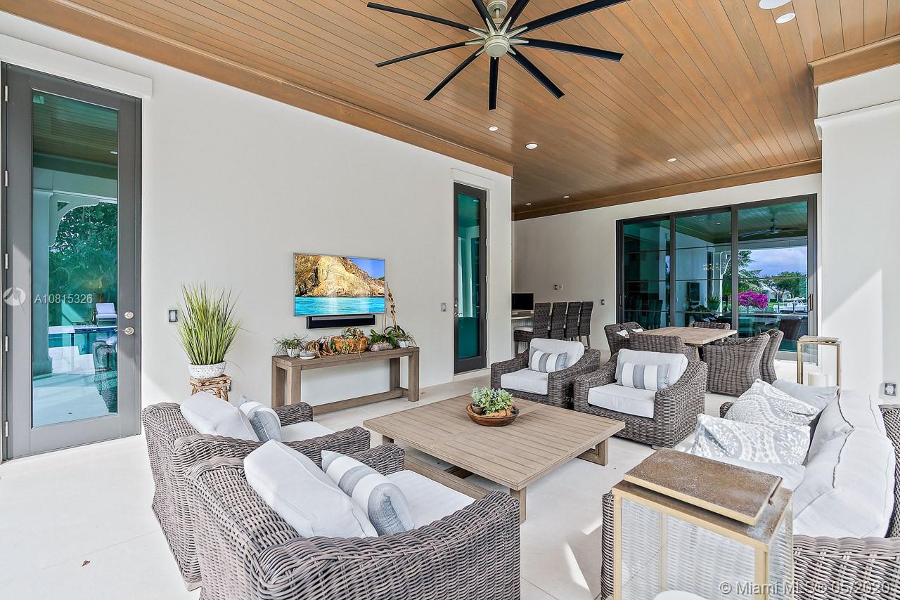 220 Commodore Drive Jupiter, FL 33477 - Photo 42 of 55 a living room with furniture and a flat screen tv