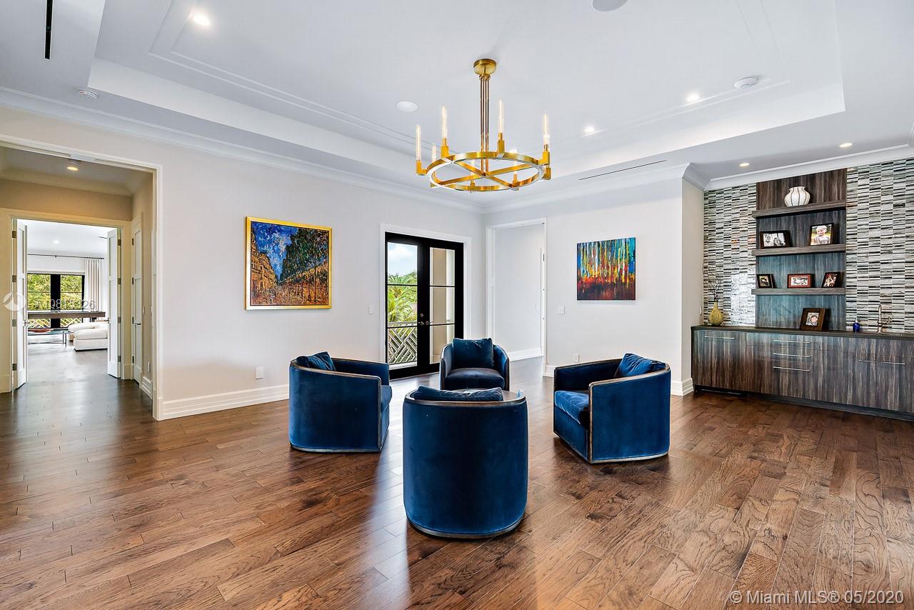 220 Commodore Drive Jupiter, FL 33477 - Photo 44 of 55 a view of a livingroom with furniture and wooden floor