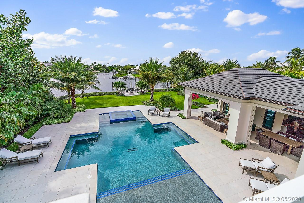 220 Commodore Drive Jupiter, FL 33477 - Photo 45 of 55 an aerial view of a house with swimming pool and patio