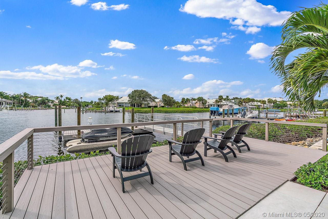 220 Commodore Drive Jupiter, FL 33477 - Photo 5 of 55 a view of a terrace with furniture and a table