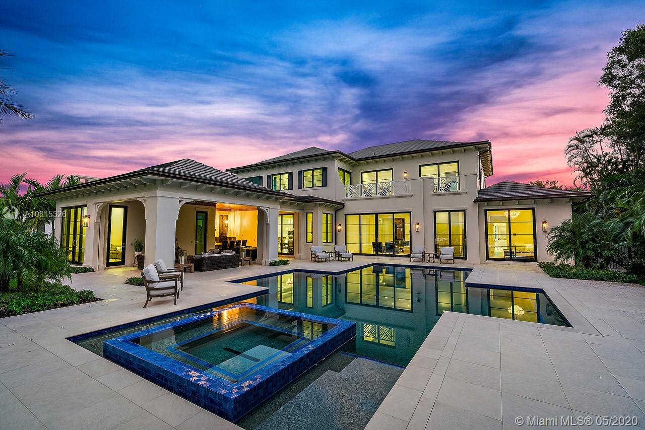 220 Commodore Drive Jupiter, FL 33477 - Photo 6 of 55 a view of a house with pool and chairs