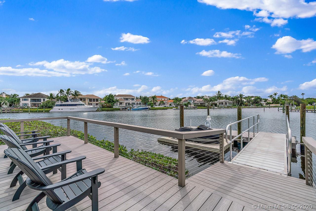 220 Commodore Drive Jupiter, FL 33477 - Photo 7 of 55 a view of a terrace with wooden floor and city view