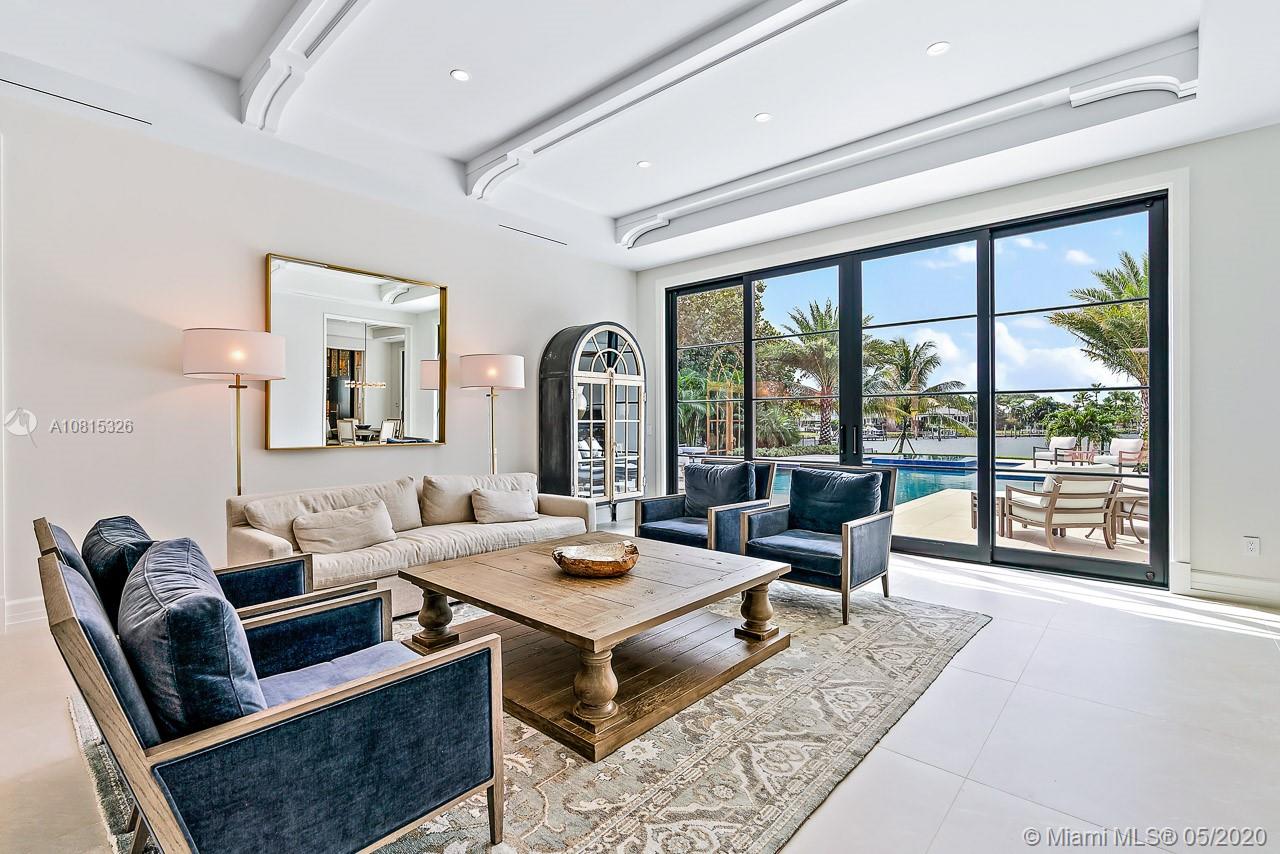 220 Commodore Drive Jupiter, FL 33477 - Photo 10 of 55 a living room with furniture and large windows