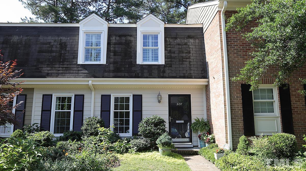 3137 Morningside Drive Raleigh, NC 27607 - Photo 1 of 15 front view of house with a yard and potted plants