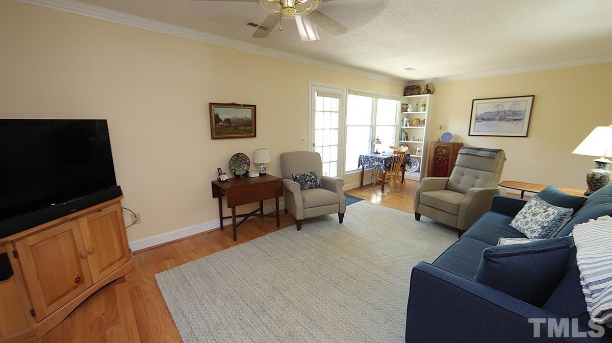 3137 Morningside Drive Raleigh, NC 27607 - Photo 6 of 15 a living room with furniture and a flat screen tv