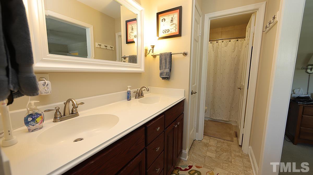 3137 Morningside Drive Raleigh, NC 27607 - Photo 9 of 15 a bathroom with a sink and a mirror