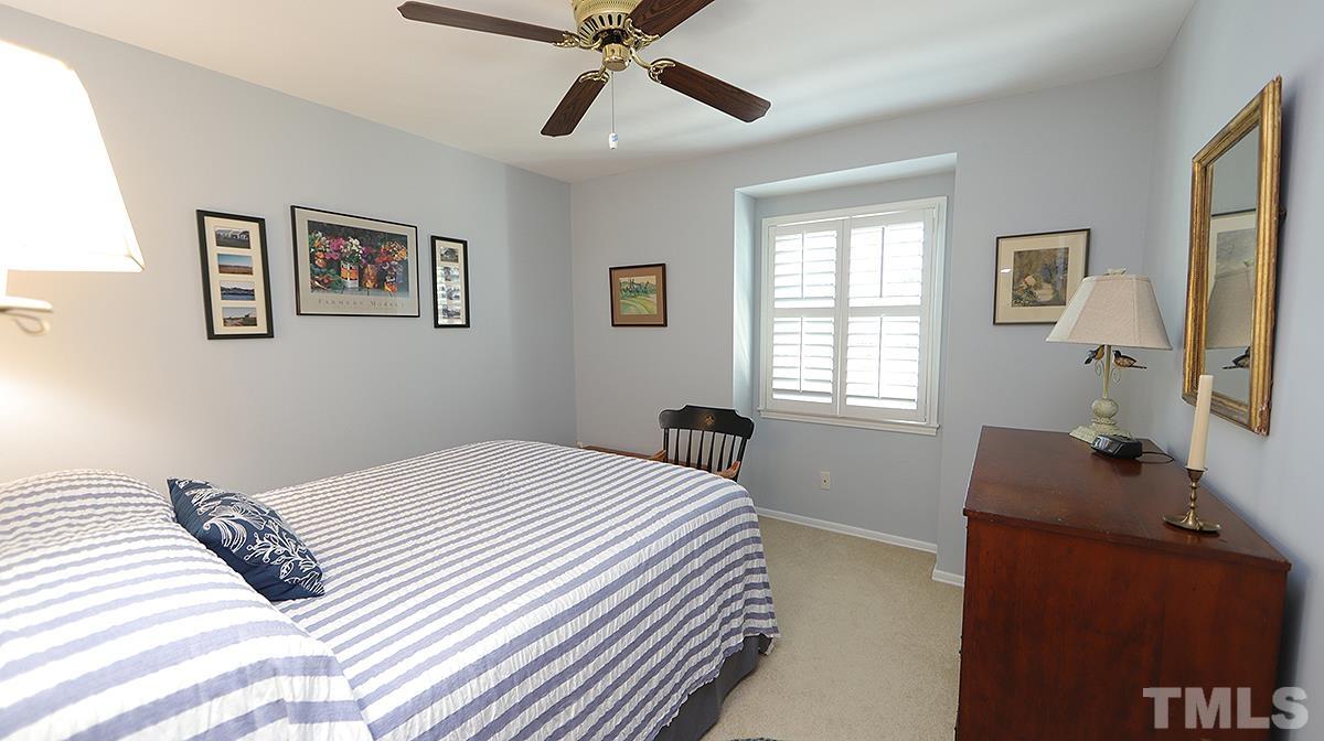 3137 Morningside Drive Raleigh, NC 27607 - Photo 10 of 15 a bedroom with a bed and a window