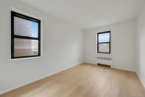 a living room with furniture and next to a window