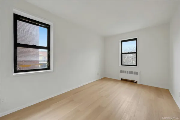 a living room with furniture and next to a window