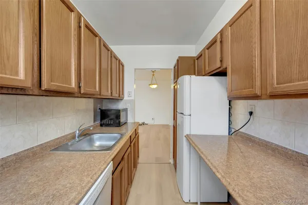 a kitchen that has a sink and a stove