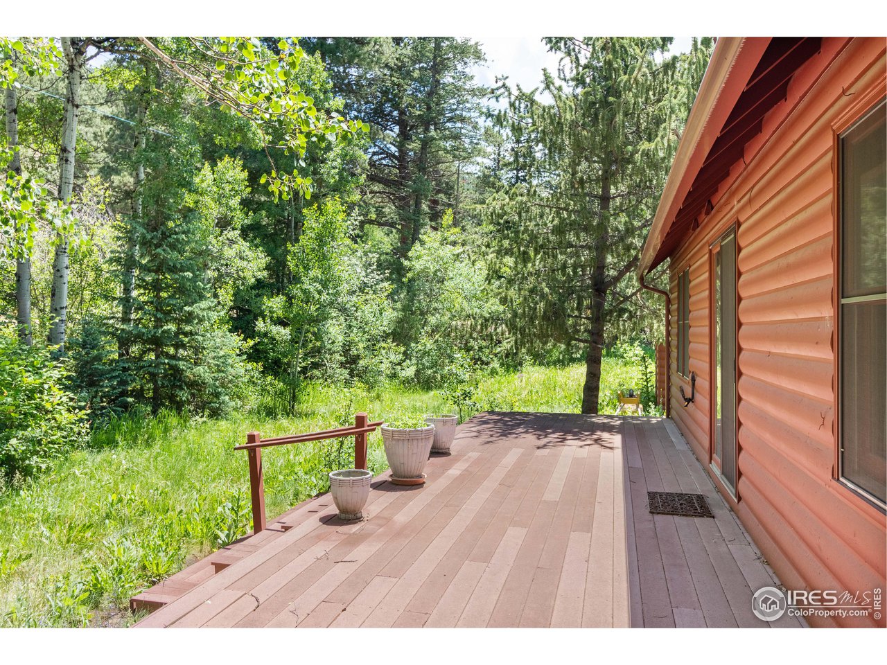 702 Riverside Drive Lyons, CO 80540 - Photo 17 of 19 a view of an outdoor space with a garden