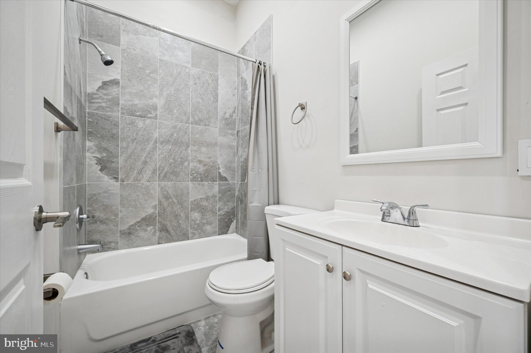 232 South Edgewood Street Philadelphia, PA 19139 - Photo 15 of 25 Modern bathroom with sleek finishes.