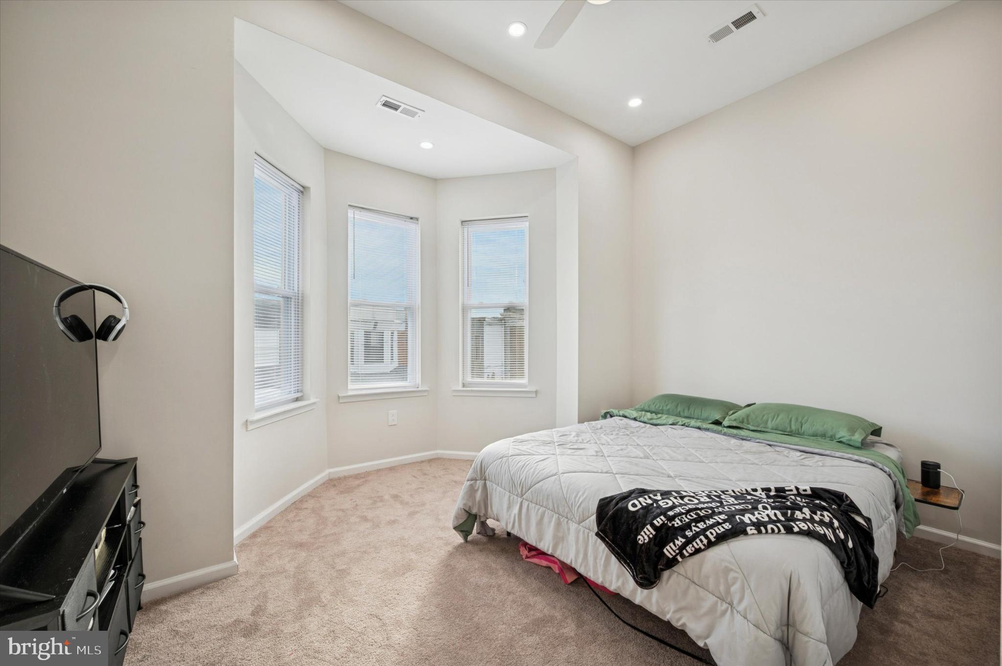 232 South Edgewood Street Philadelphia, PA 19139 - Photo 18 of 25 Bright and airy bedroom with bay windows.