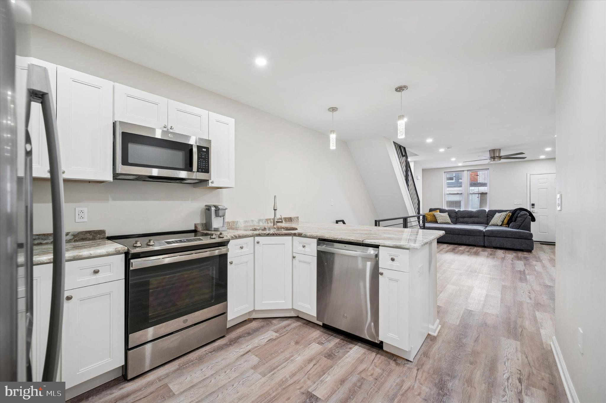 232 South Edgewood Street Philadelphia, PA 19139 - Photo 8 of 25 Modern kitchen with sleek finishes.
