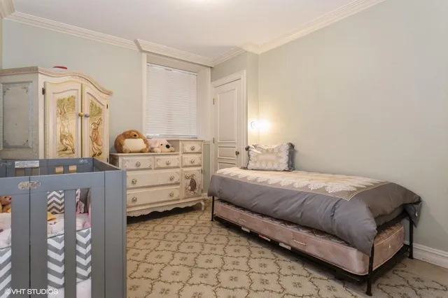a bedroom with a bed and dresser