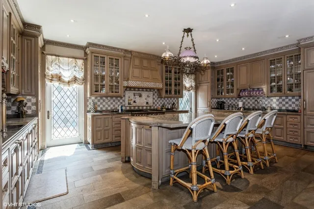 a kitchen with a table and chairs