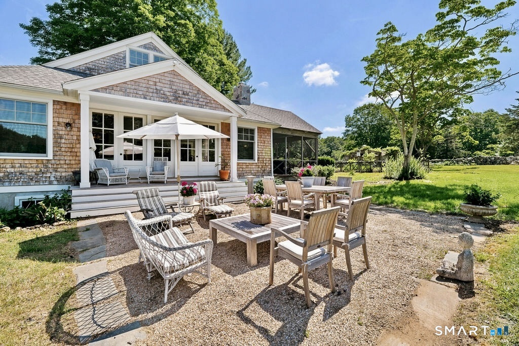 261-1 Grassy Hill Road Lyme, CT 06371 - Photo 33 of 40 The stone patio provides the perfect setting for al fresco dining, leisurely afternoons, and effortless outdoor entertaining.